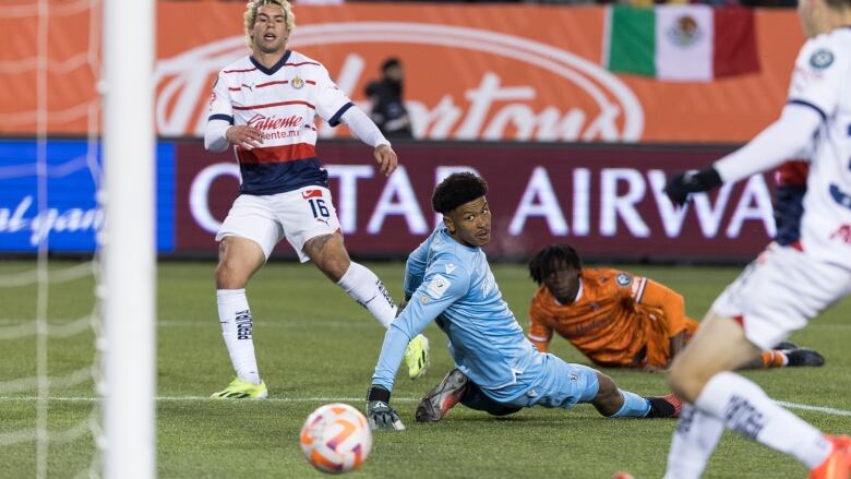 Chivas Guadalajara forward Cade Cowell (16) scores a goal as Hamilton Forge FC goalkeeper Christopher Kalongo (29) looks on during round one of the 2024 CONCACAF Champions Cup in Hamilton on Wednesday, February 7, 2024. 