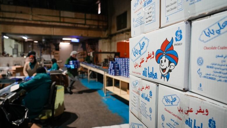 Boxes of Palestinian-made chocolate wafer cookies wait to be shipped from Ramallah.  The company lost all of its business in Gaza after October 7th.