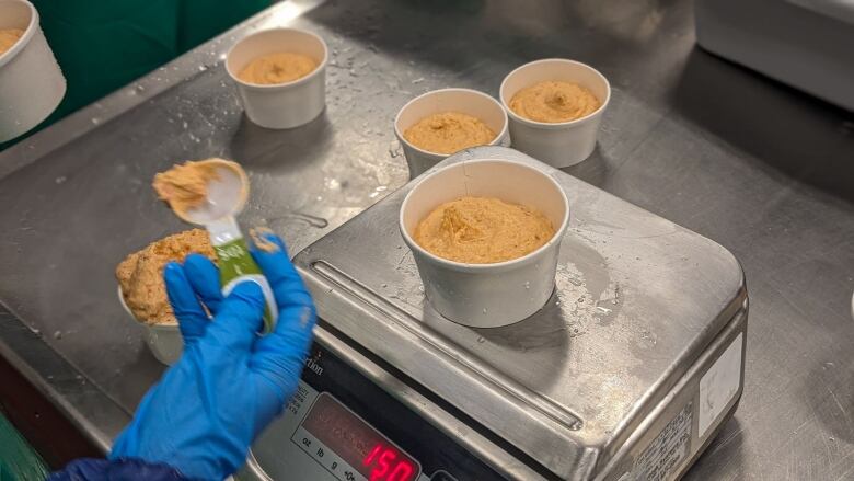 Lobster dip being weighed on a digital scale 