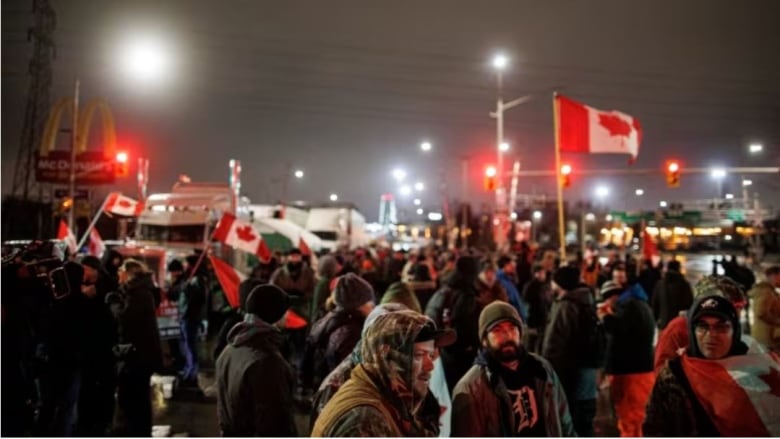 Anti-mandate protesters maintain a blockade of the Ambassador Bridge border crossing, in Windsor, Ont., on Feb. 11, 2022.