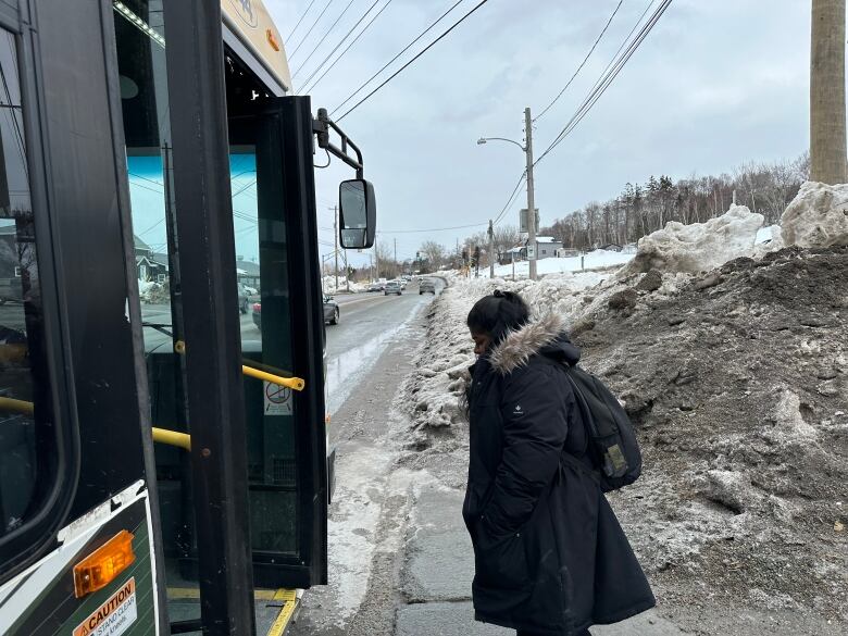 woman boards bus in Sydney 