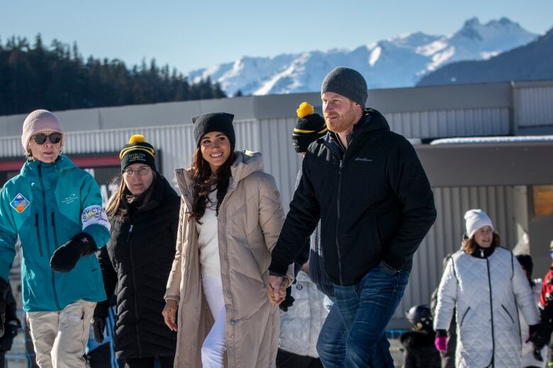 Megan and Harry in Whistler with white capped mountains in the background