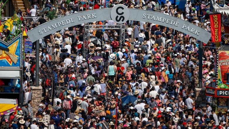 A huge crowd is shown at the Calgary Stampede midway.