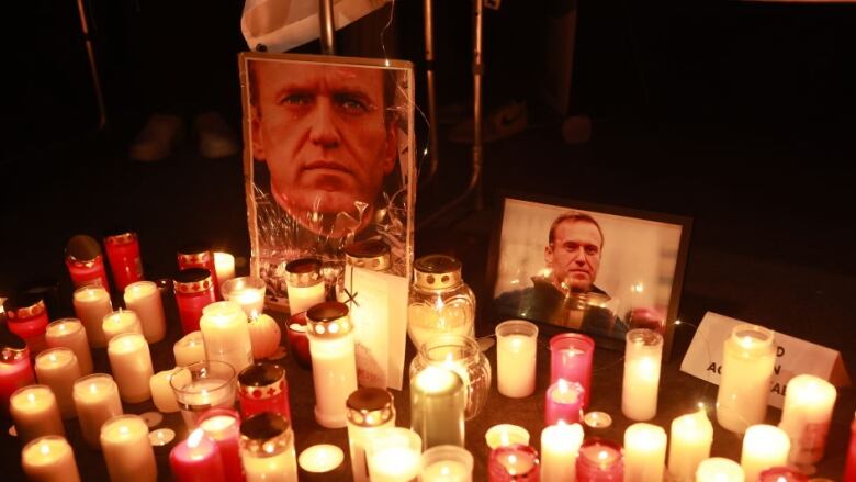 Candles burn during a vigil for Alexiei Navalny.