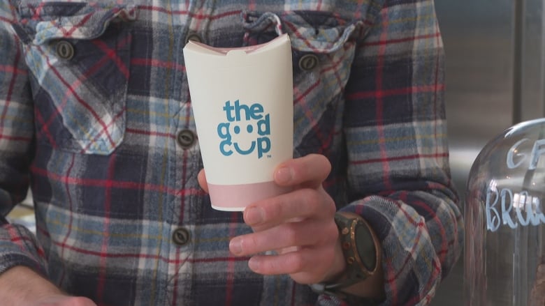 A paper cup with the words 