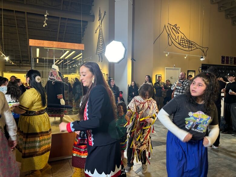 Women seen dancing in mi'kmaw regalia