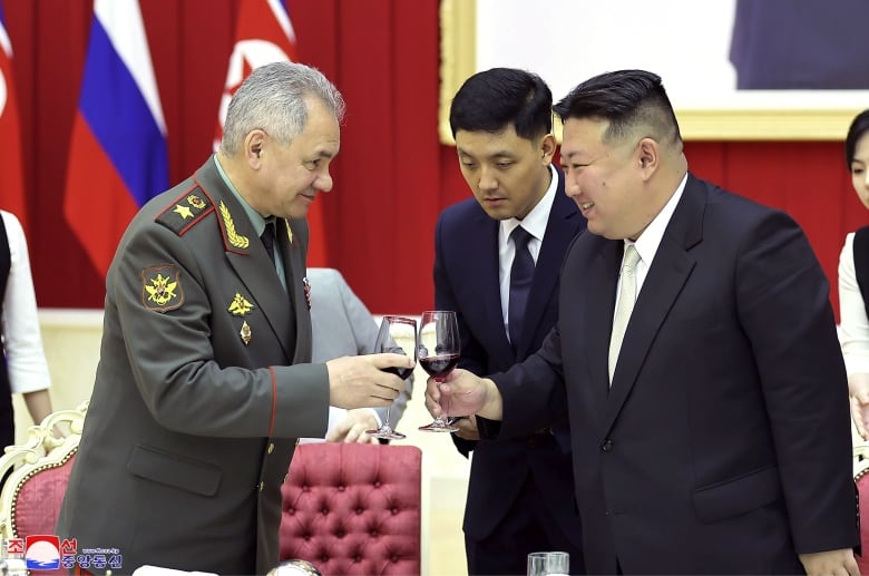 In this photo provided by the North Korean government, North Korean leader Kim Jong Un, right, and Russian Defence Minister Sergei Shoigu, left, toast at a banquet hall of the ruling Workers' Party's headquarters in Pyongyang, North Korea on Thursday, July 27, 2023.