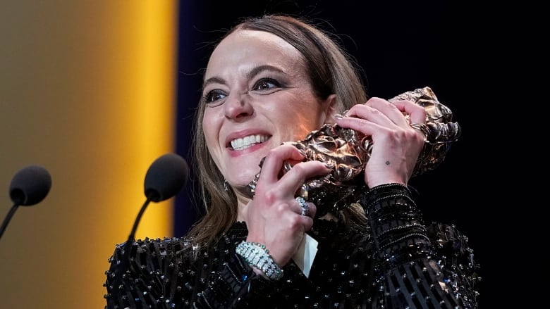 Monia Chokri holds the Best Foreign Film Cesar Award 