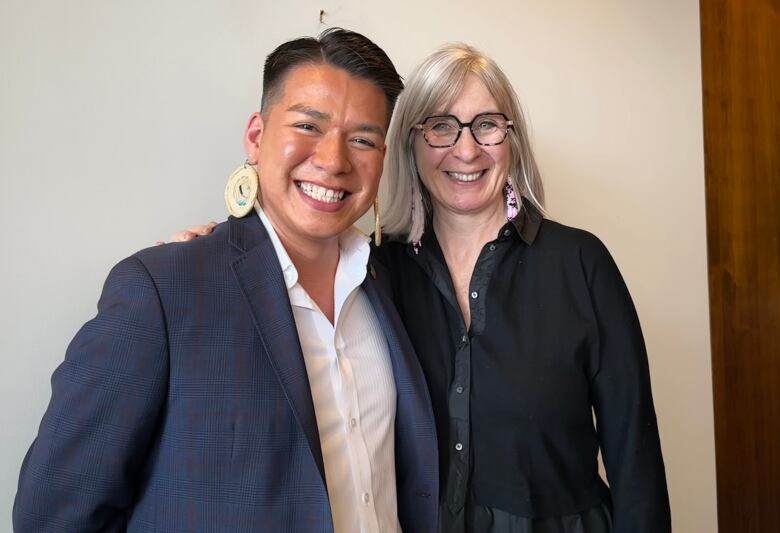 a lawyer from Olthuis Kleer Townshend LLP poses for a photo with Patty Hajdu, the  Minister of Indigenous Services of Canada.