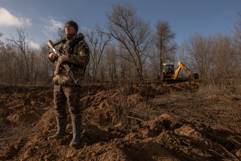 A Ukrainian soldier keeps watch for Russian drones in Ukraine's Zaporizhzhia region in January 2024.