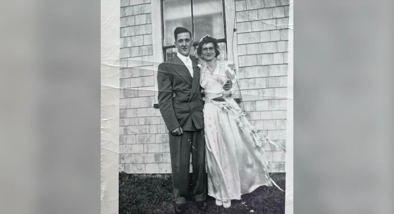 A black and white picture of a couple.