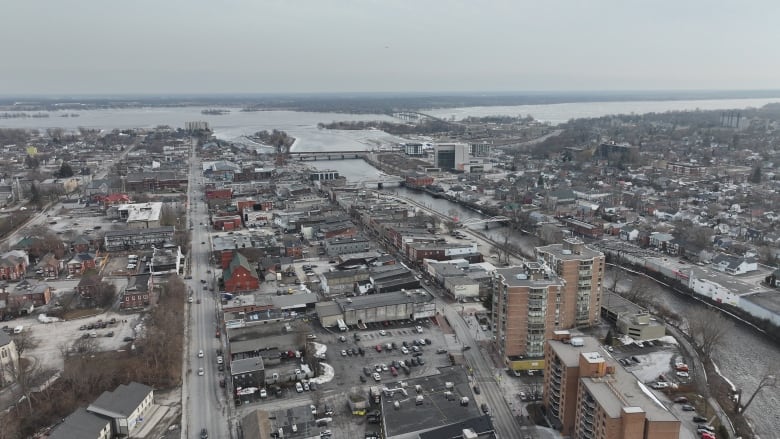 A mid-sized city next to a lake in late winter.