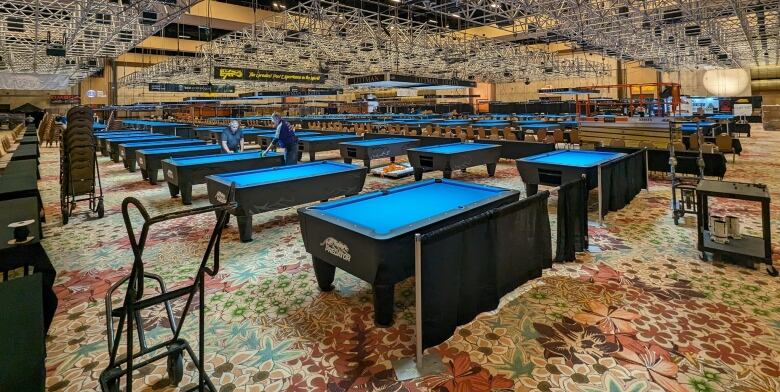 rows of blue pool tables. 