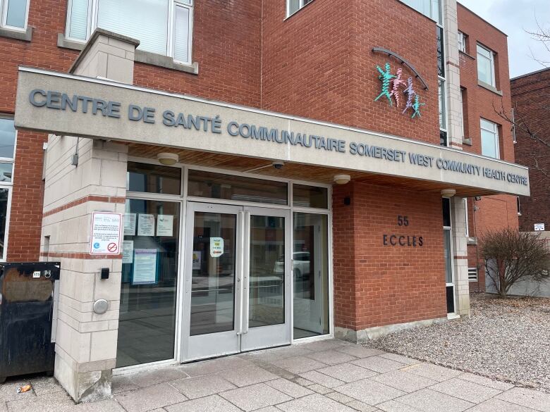 The entrance to a community health centre in a city in late winter.