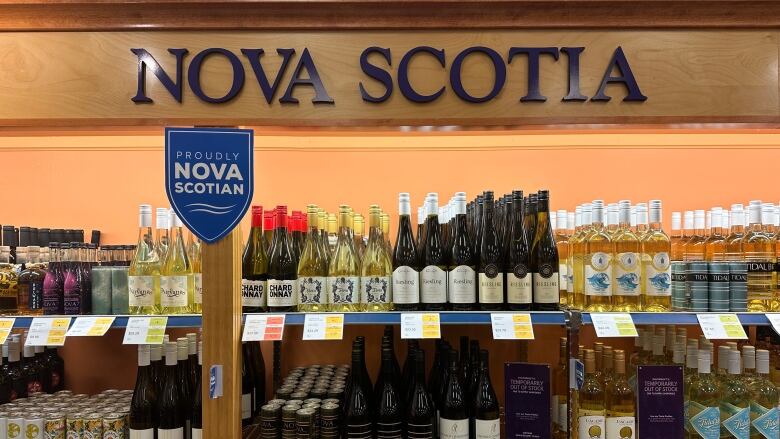 Several Nova Scotian wines are displayed at an NSLC location. A sign above the wines says Nova Scotia.