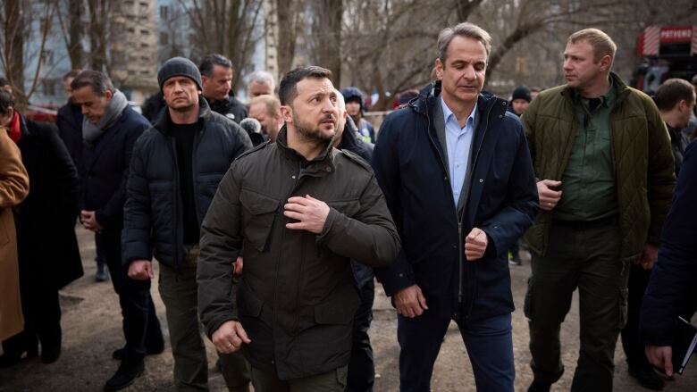 Ukrainian President Volodymyr Zelenskyy and Greek Prime Minister Kyriakos Mitsotakis walk in Odesa on Wednesday.