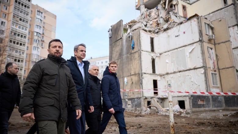 Ukrainian President Volodymyr Zelenskyy is seen walking alongside Greek Prime Minister Kyriakos Mitsotakis in Odesa, Ukraine, on Wednesday.