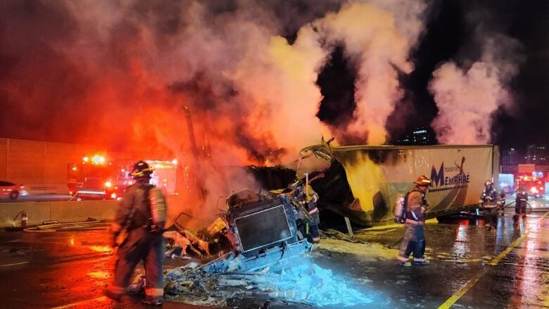 The driver of a transport truck loaded with cardboard collided with a guard rail on Highway 401 overnight, causing the truck to catch fire.