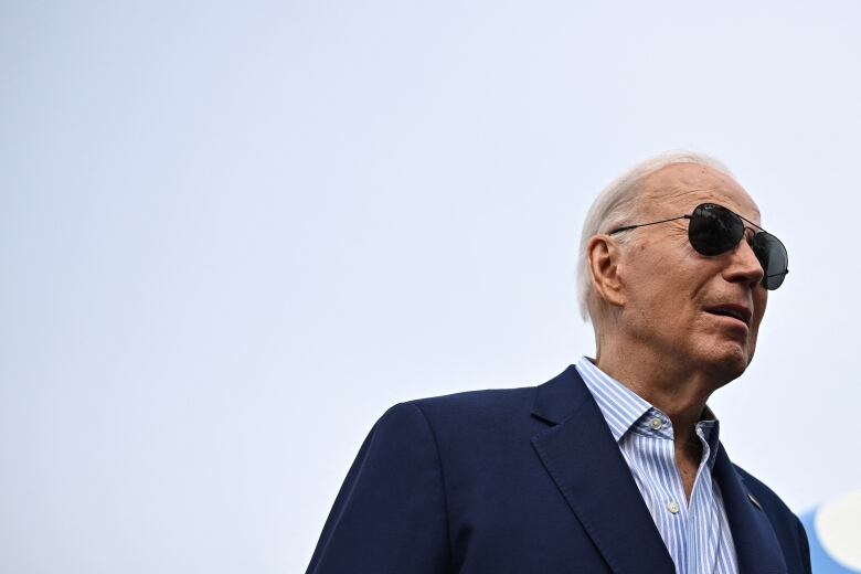 U.S. President Joe Biden is seen speaking to members of the media at Joint Base Andrews in Maryland.