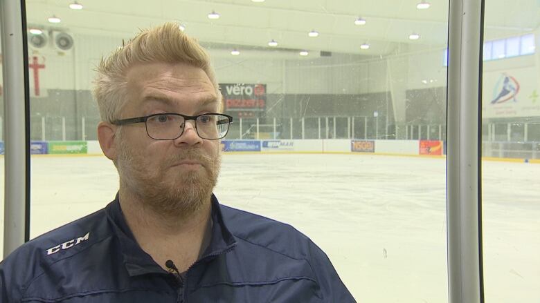 Peter stands in front of an ice pad at the RBC Centre in Darmtouth, N.S.