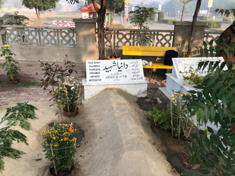 Dania Zafar's final resting spot in Lahore, Pakistan which her father has surrounded with flowers.