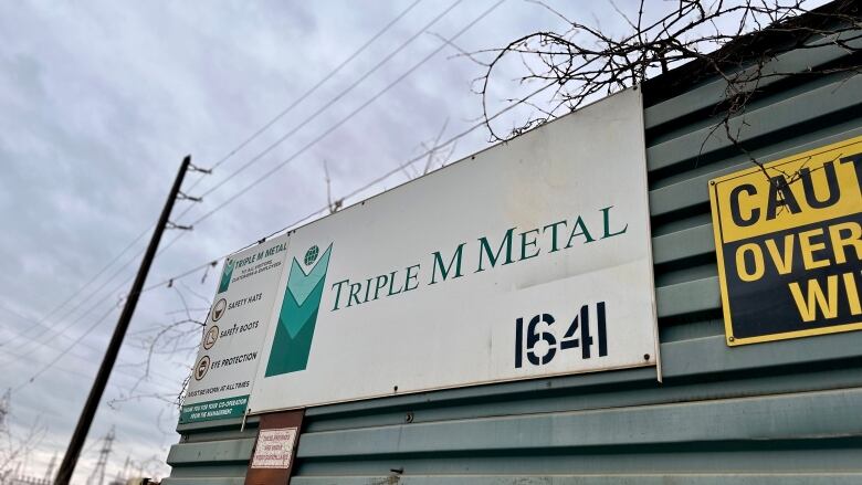 Triple M Metal sign