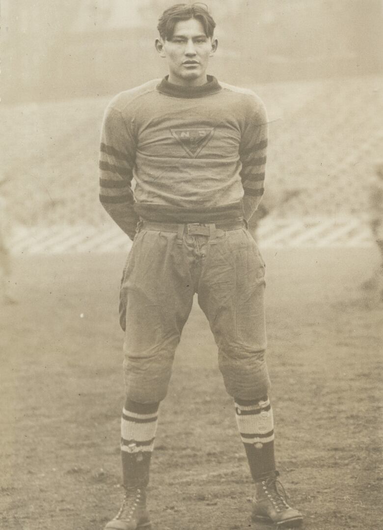 A black and white pictured of man wearing rugby gear is shown.