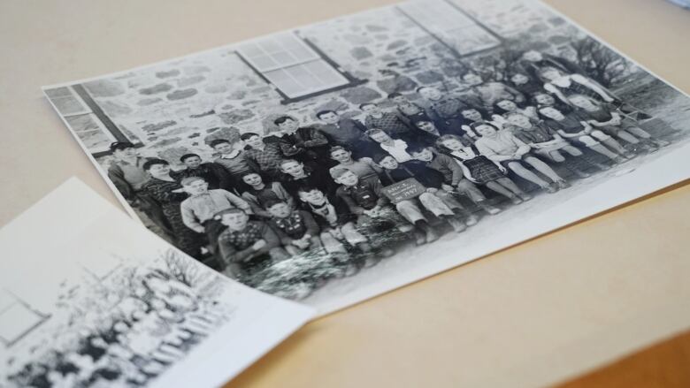 An old photograph of children in front of a school.