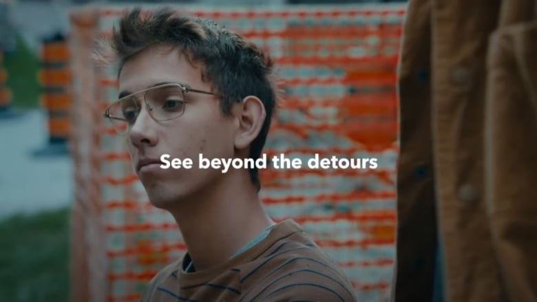 A man with glasses looks to the side in a Metrolinx ad.