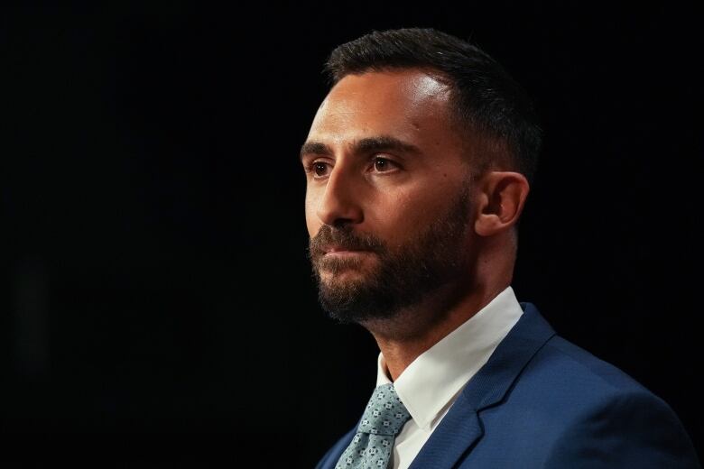 Ontario Education Minister Stephen Lecce speaks to journalists at Queen's Park in Toronto on Aug. 25, 2023.