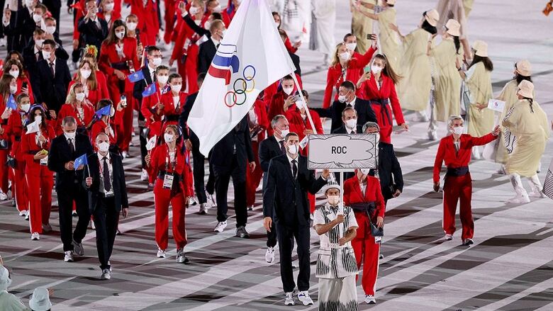 Flag bearers lead Team Russian Olympic Committee in the opening ceremony of the 2021 Summer Games on July 23, 2021 in Tokyo.