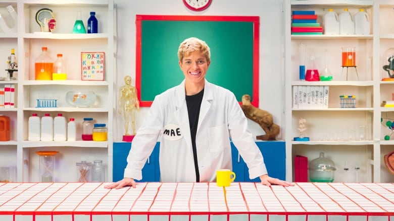 Mae Martin poses on the laboratory set built for Fluid: Life Beyond the Binary.