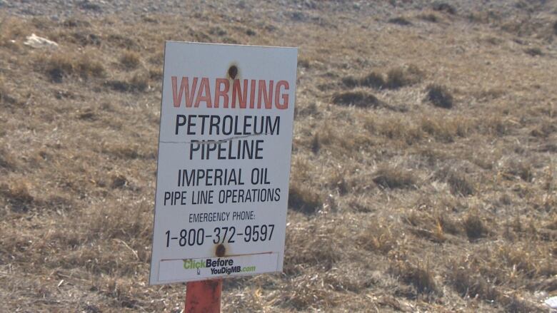 A sign warning of a pipeline. 