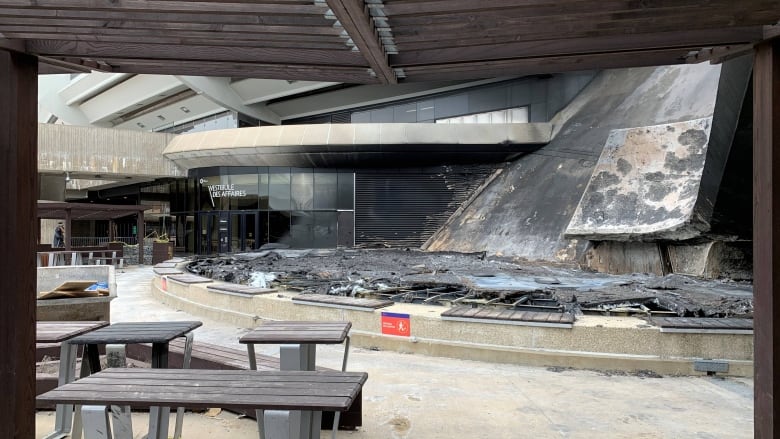 Charred materials near benches in the Olympic Park. 