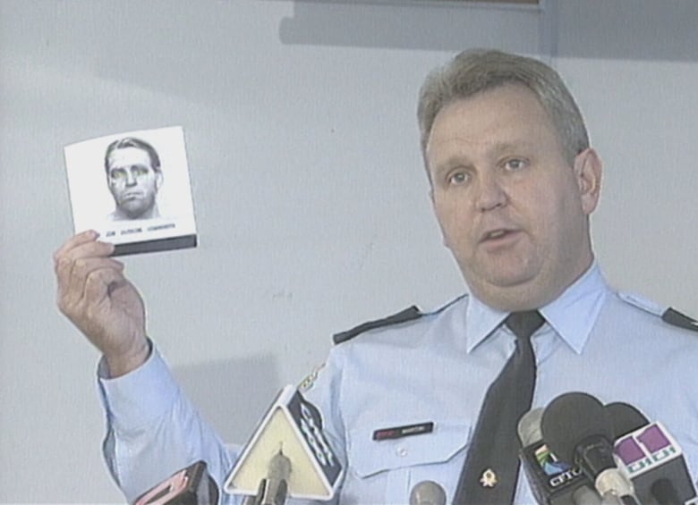 A Halton Regional Police officer is seen in 1995 holding a composite sketch of the child sex predator dubbed the 