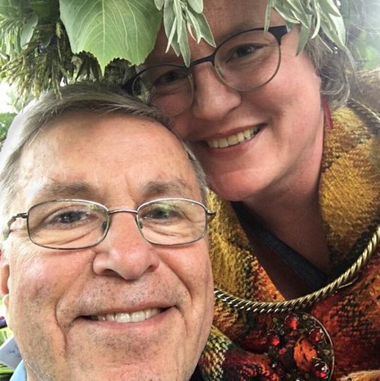 Selfie of smiling man and woman.