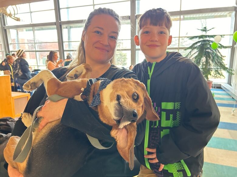 Erin MacDonald, left, and Jackson MacEachern with Andre the beagle.