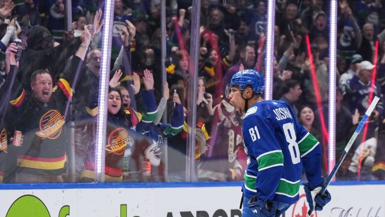 Vancouver Canucks' Dakota Joshua celebrates his second goal during third period NHL hockey action against the Anaheim Ducks, in Vancouver, B.C., Sunday, March 31, 2024. 