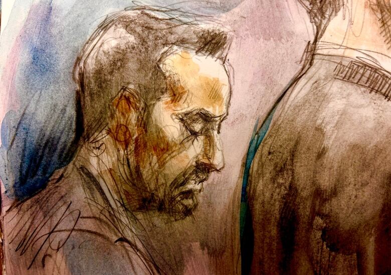 Umar Zameer listens to his wife's testimony during his trial.