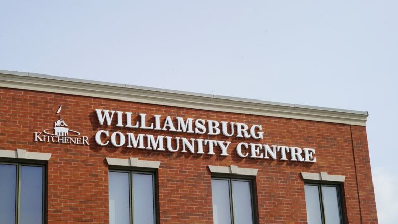 A sign on a red brick building.