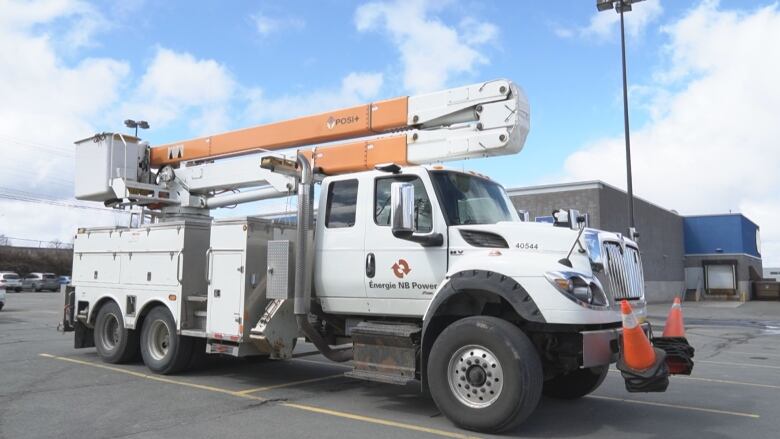 NB power truck in a parking lot