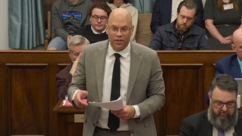 Gord McNeilly stands in the provincial legislature