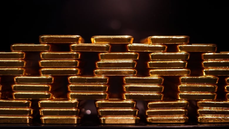 A 2014 file photo shows a stack of gold bars, as seen at the ProAurum gold house in Munich, Germany.