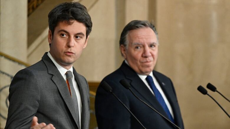 Gabriel Attal and Francois Legault holding a press conference.