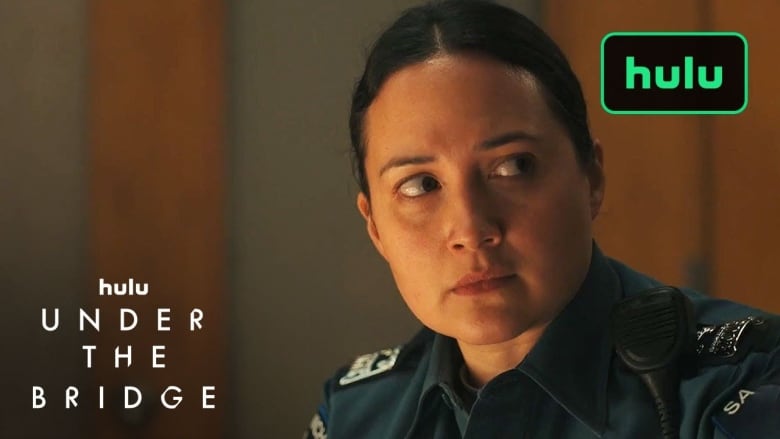 A screengrab of a woman in a police officer's uniform.