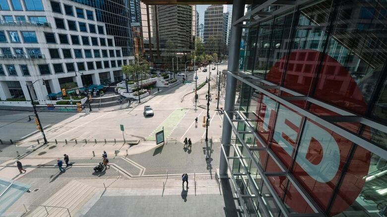 An exterior photograph showing the Vancouver Convention Centre with a TED sign prominent.