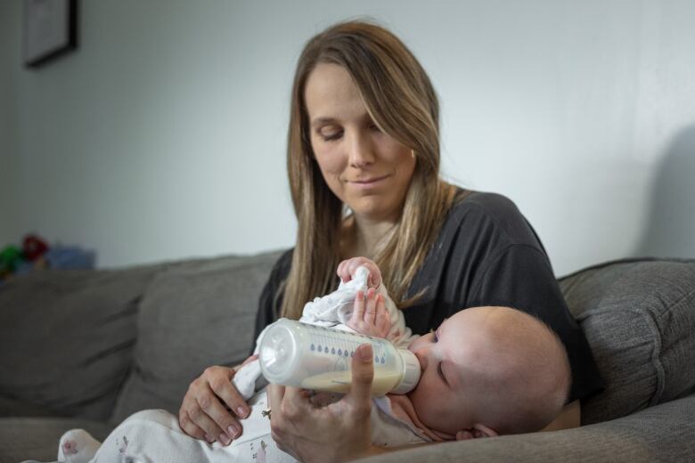 Samantha Nicholson feeds her five-month-old daughter Lila. 