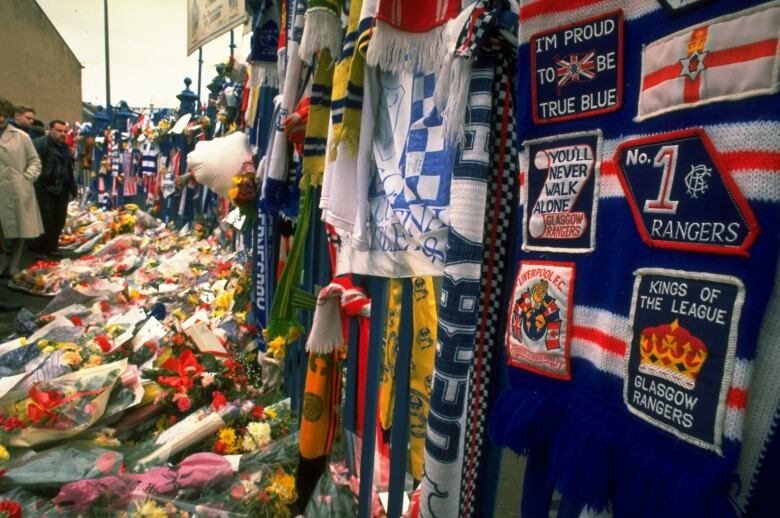 1989:  Tributes cover a fence and path in the aftermath of the disaster at Hillsborough in Sheffield, England. \ Mandatory Credit: Pascal  Rondeau/Allsport