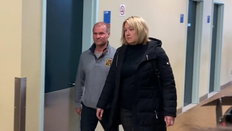 A woman walks through a court house