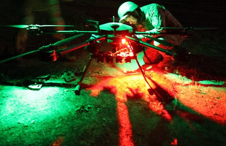 A Ukrainian soldier prepares a night drone for operation near a front-line position near Chasiv Yar, Ukraine.